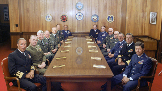 This is a group photograph of the Joint Chiefs of Staff and several Commanders in Chiefs taken on July 1, 1983, in the Chairman of the Joint Chiefs of Staff dining room, located in the Pentagon. Shows (left to right): U.S. Navy Adm. Wesley L. McDonald, Commander in Chief, US Atlantic Command; U.S. Marine Corps Gen. Paul X. Kelley, Commandant of the Marine Corps; U.S. Army Gen. Paul F. Gorman, Commander in Chief, US Southern Command; U.S. Army Lt. Gen. Robert C. Kingston, Commander in Chief, US Central Command; U.S. Army Gen. John A. Wickham, Chief of Staff, US Army; U.S. Army Gen. Wallace H. Nutting, Commander in Chief, US Readiness Command; U.S. Air Force Gen. James V. Hartinger, Commander in Chief, Aerospace Defense Command; U.S. Navy Adm. William J. Crowe, Commander in Chief, US Pacific Command; U.S. Air Force Gen. Charles A. Gabriel, Chief of Staff, U.S. Air Force; U.S. Army Bernard W. Rogers, Commander in Chief, US European Command; U.S. Army Gen. John W. Vessey, Jr., Chairman of the Joint Chiefs of Staff; U.S. Air Force Gen. Bennie L. Davis, Commander in Chief, US Strategic Air Command; U.S. Navy Adm. James D. Watkins, Chief of Naval Operations; and U.S. Air Force Gen. Thomas M. Ryan, Commander in Chief, Military Airlift Command. OSD Package No. A07D-00347 (DOD Photo by Robert D. Ward) (Released)